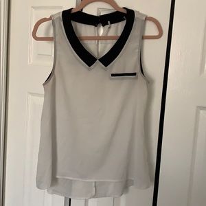 Chic office sleeveless top with black trim collar
